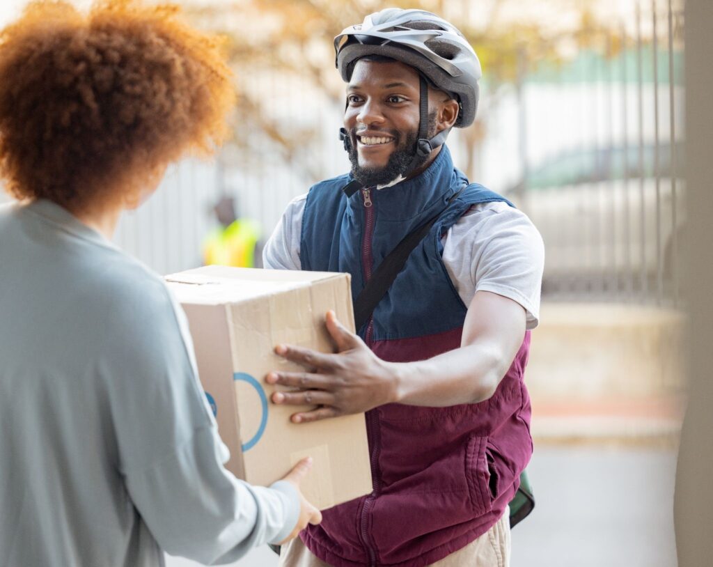 person delivering a package in a gated community