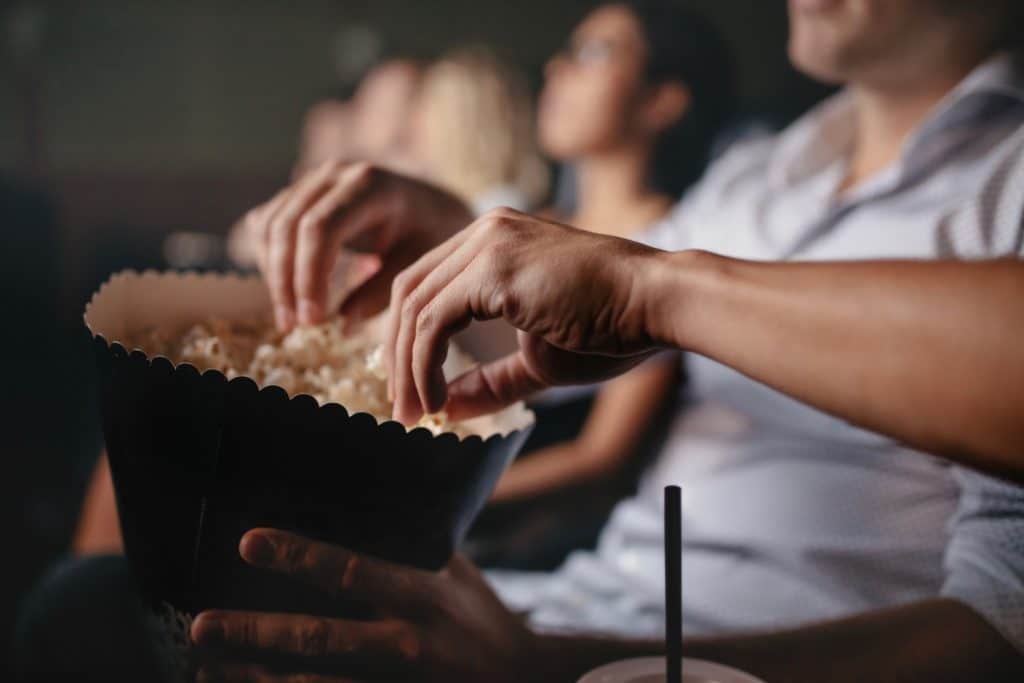 People enjoying a film at the movie theater